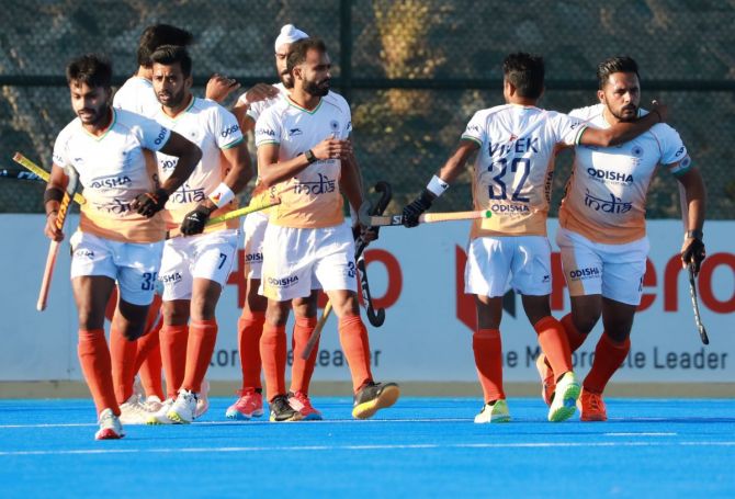 India's players celebrate a goal against Pakistan