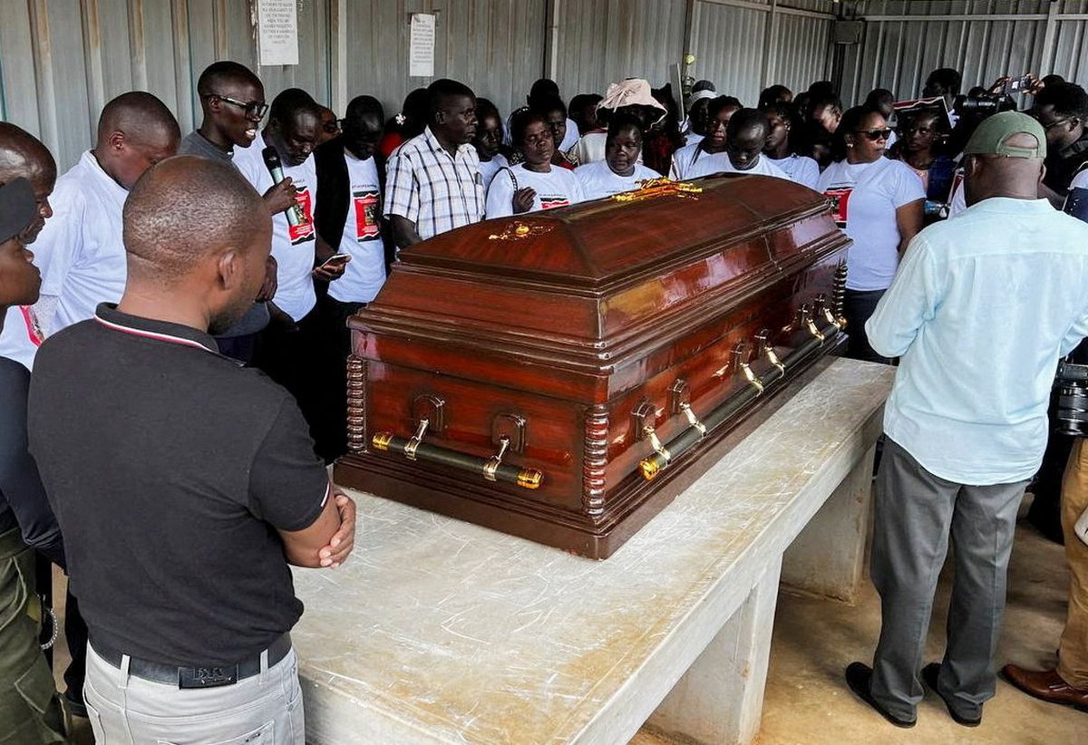 Family members mourn and react next to the coffin of the slain Olympian Rebecca Cheptegei