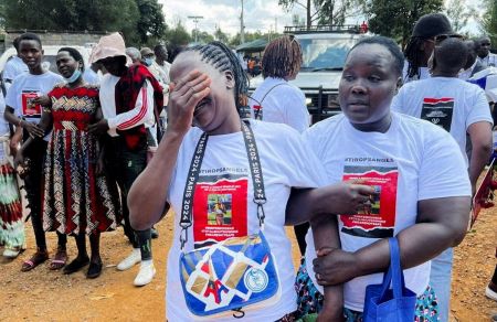 Agnes Cheptegei mourns next to the coffin of her daughter and Olympian Rebecca Cheptegei