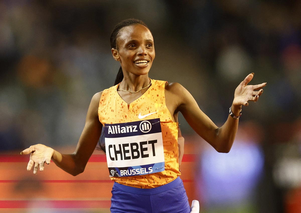 Kenya's Beatrice Chebet is all smiles as she crosses the finish line first in the women's 5000 metres.