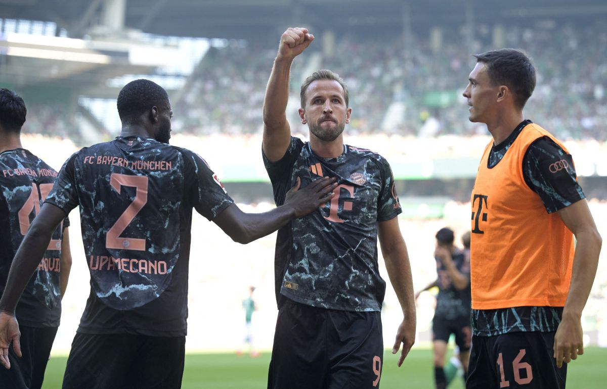 Bayern Munich's Harry Kane celebrates scoring their third goal with teammates