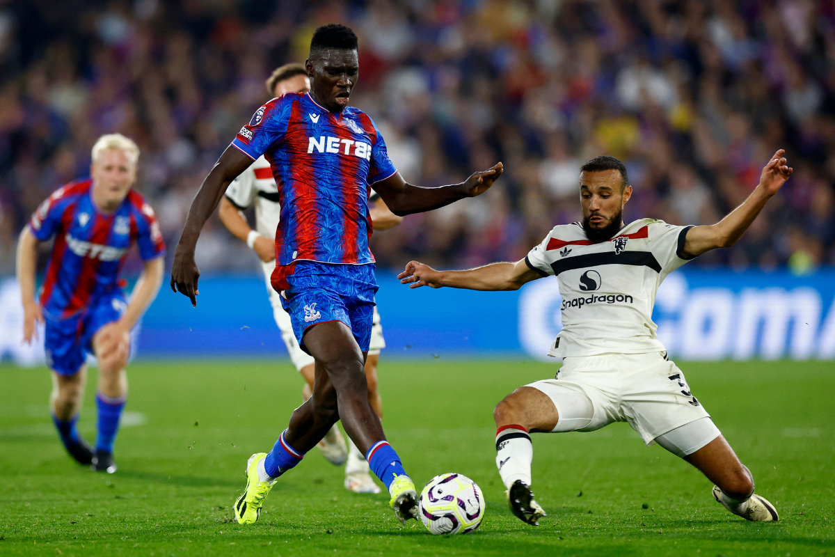 Crystal Palace's Ismaila Sarr in action with Manchester United's Noussair Mazraoui 