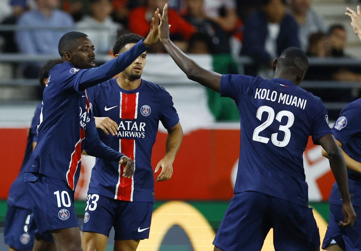 PSG's Ousmane Dembele celebrates scoring their first goal with Randal Kolo Muani