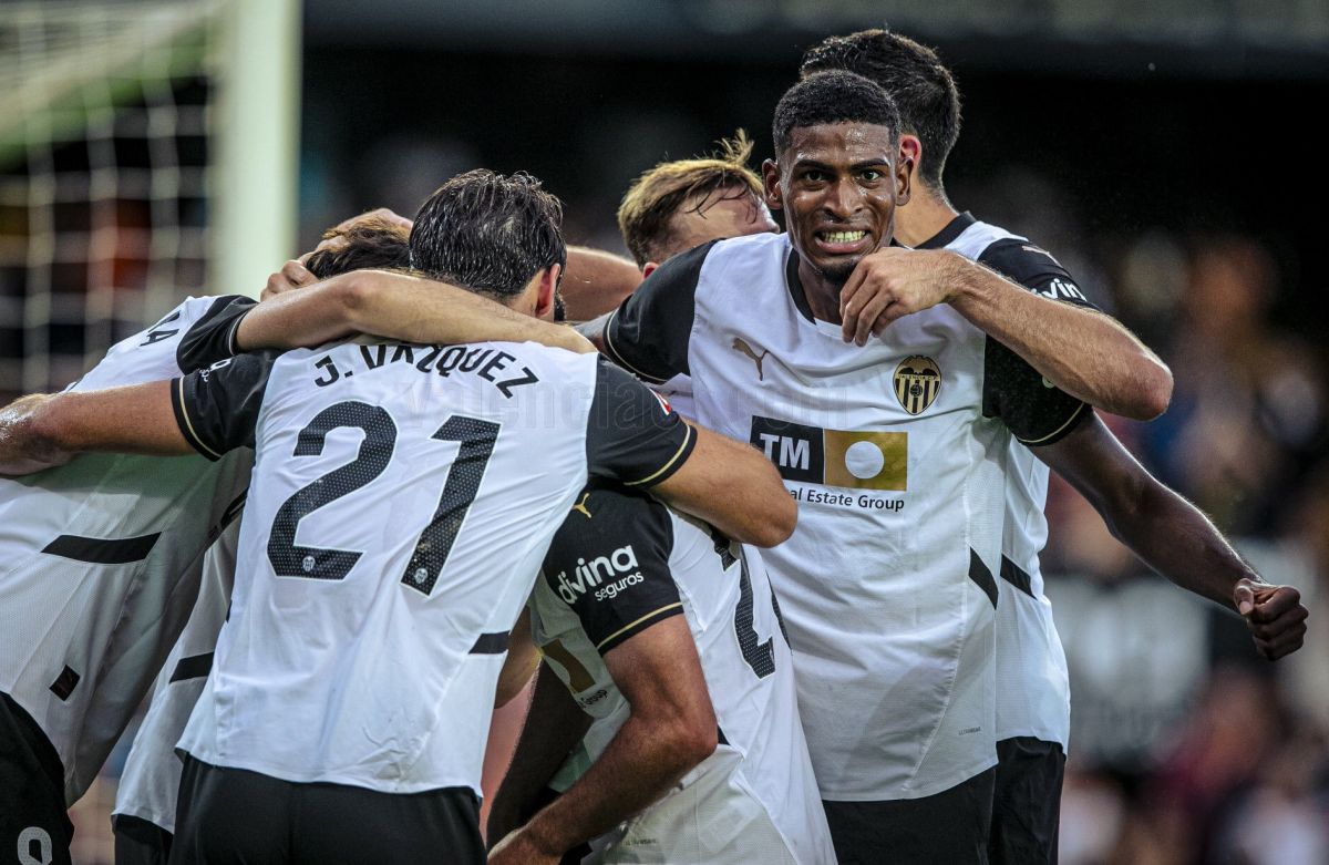 Valencia's players celebrate winning the match