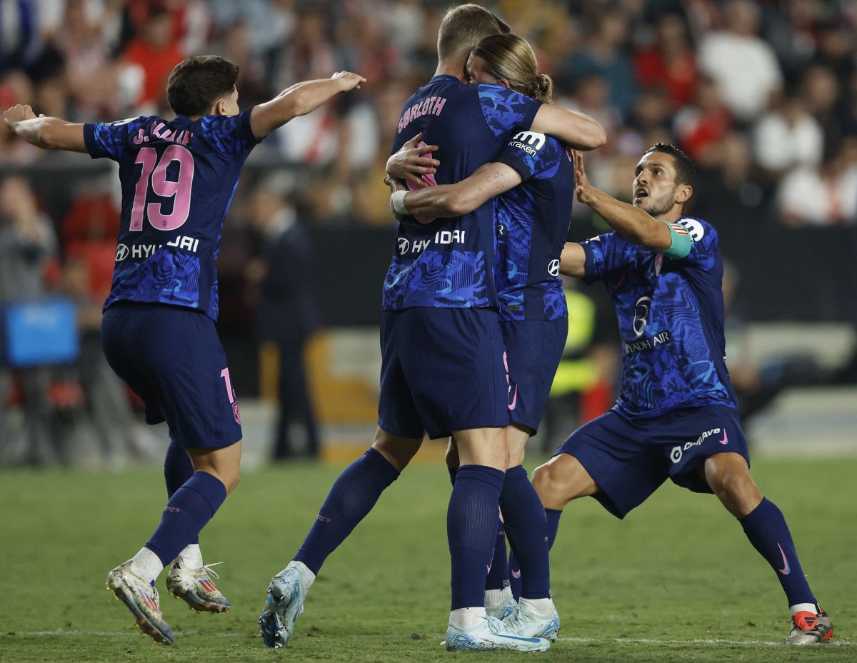 Atletico Madrid's Conor Gallagher celebrates scoring their first goal with teammates