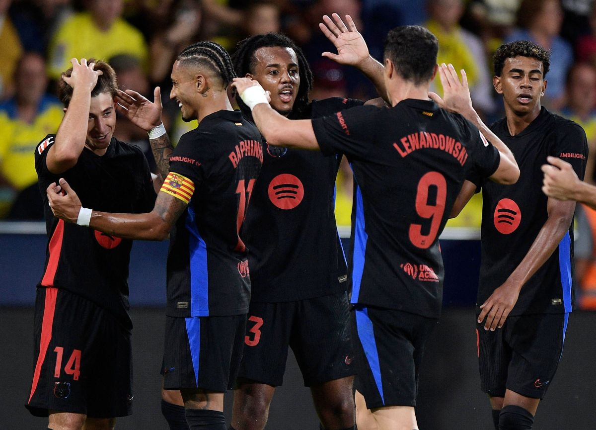 Barcelona's Pablo Torre celebrates scoring their third goal with teammates