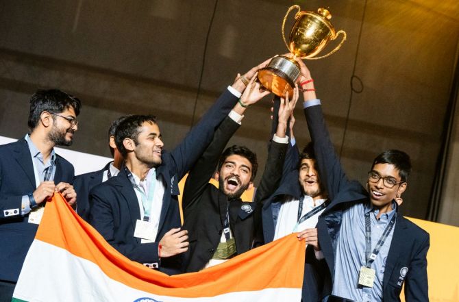 The Indian men's team celebrate with the trophy after winning the Chess Olympiad in Budapest, on Sunday