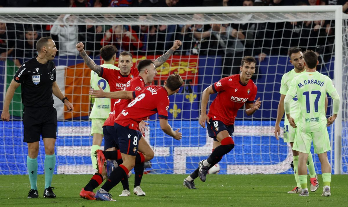 Osasuna's Abel Bretones celebrates scoring their fourth goal with teammates