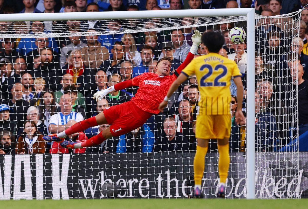 Cole Palmer scores Chelsea's third goal from a free kick past Brighton & Hove Albion goalkeeper Bart Verbruggen