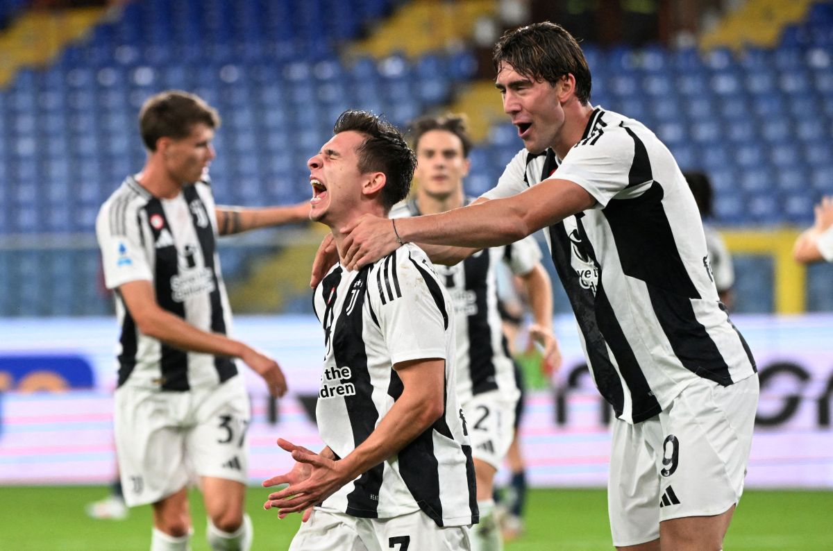 Juventus' Francisco Conceicao celebrates scoring their third goal with Dusan Vlahovic