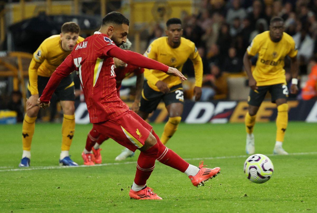 Liverpool's Mohamed Salah scores their second goal from the penalty spot