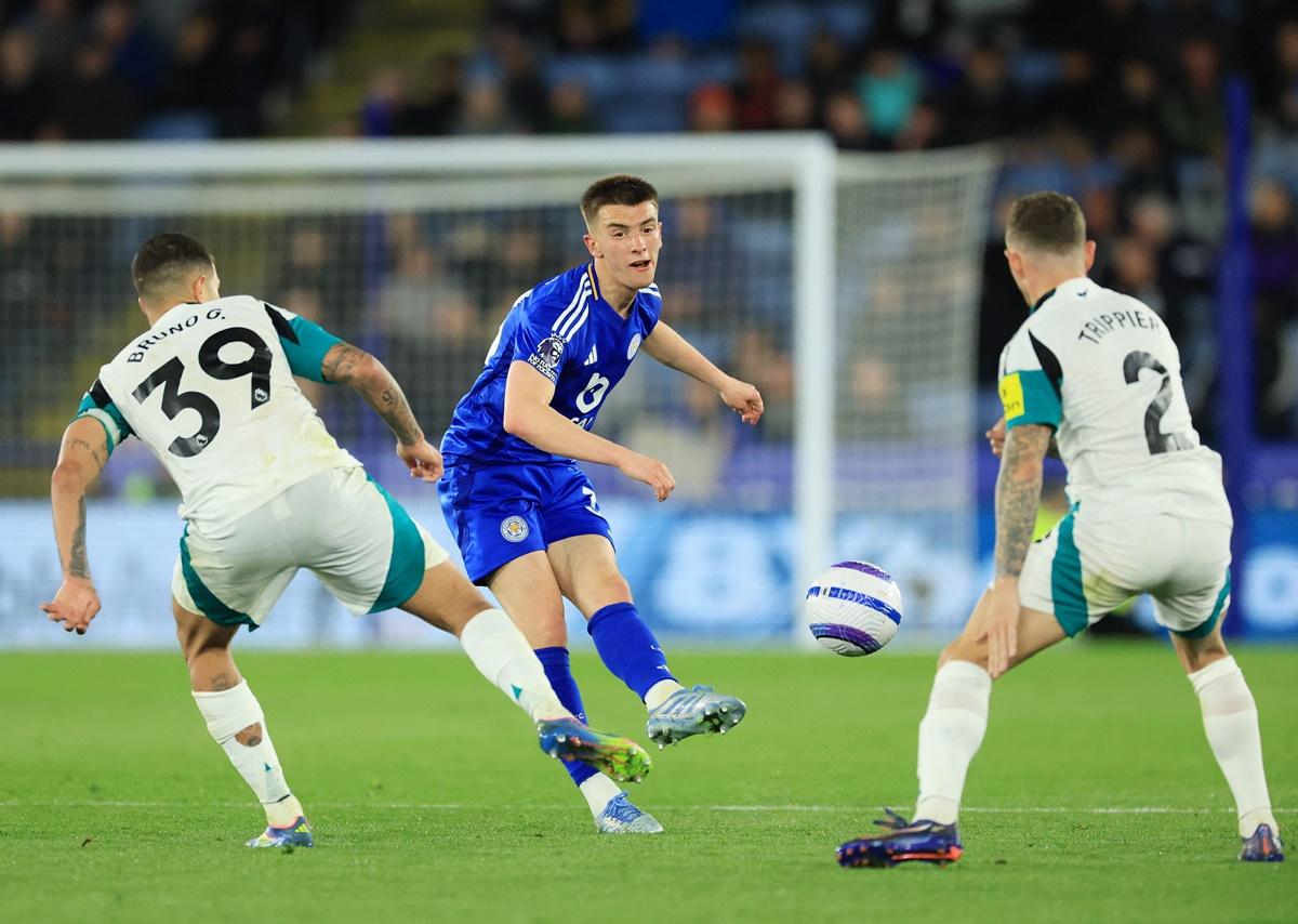 Leicester City's Luke Thomas fires the ball past Newcastle United's Bruno Guimaraes and Kieran Trippier