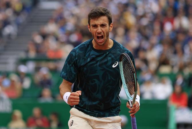 Italy's Lorenzo Musetti reacts after defeating Australia's Alex De Minaur in the second semi-final.
