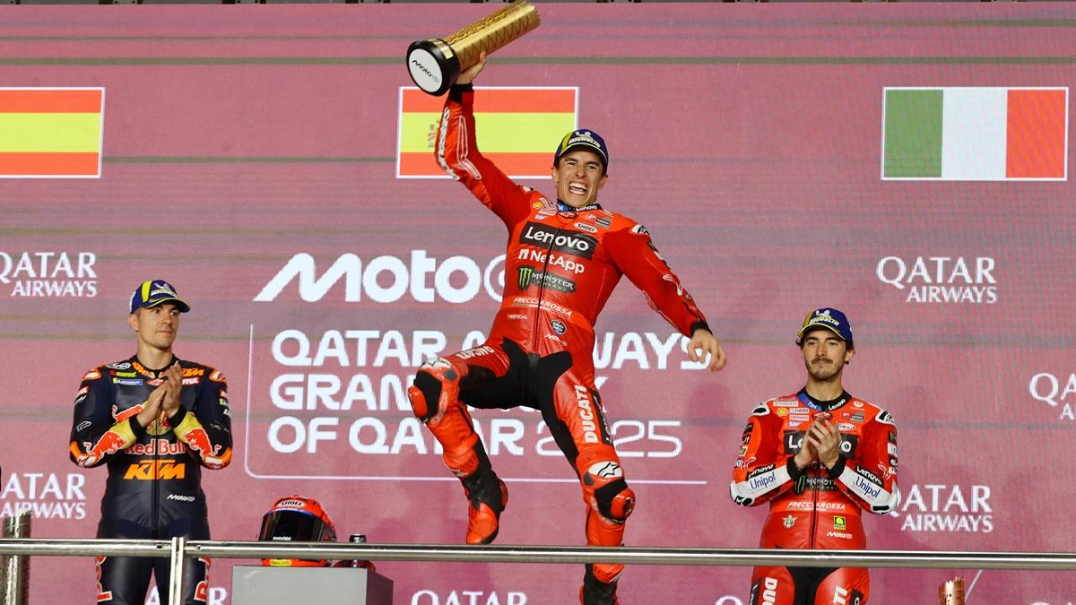 Ducati Lenovo's Marc Marquez celebrates on the podium with a trophy alongside second-placed Red Bull KTM Tech3's Maverick Vinales and third-placed Ducati Lenovo's Francesco Bagnaia after winning the Qatar Grand Prix at Lusail International Circuit, Doha, on Sunday.