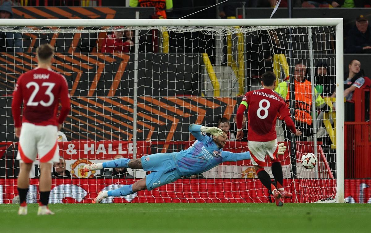 Bruno Fernandes scores Manchester United's third goal from the penalty spot past Olympique Lyonnais goalkeeper Lucas Perri.