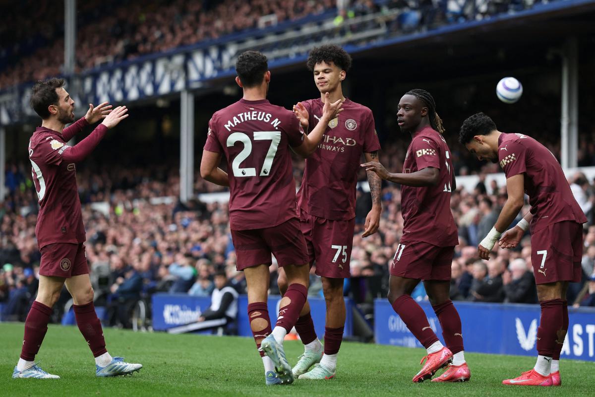 Manchester City's Nico O'Reilly celebrates with  with Bernardo Silva, Matheus Nunes, Jeremy Doku and Omar Marmoush on scoring their first goal against Everton at  Goodison Park, Liverpool, on Saturday