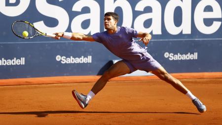 Spain's Carlos Alcaraz stretches for a return during his Barcelona Open semi-final against France's Arthur Fils at Real Club de Tenis Barcelona on Saturday.