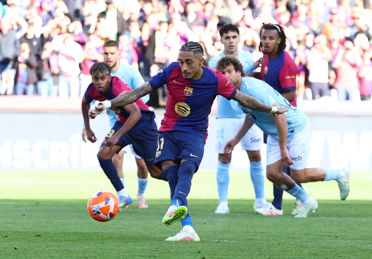 Raphinha scores Barcelona's fourth goal from the penalty spot against Celta Vigo at Estadi Olimpic Lluis Companys, Barcelona.