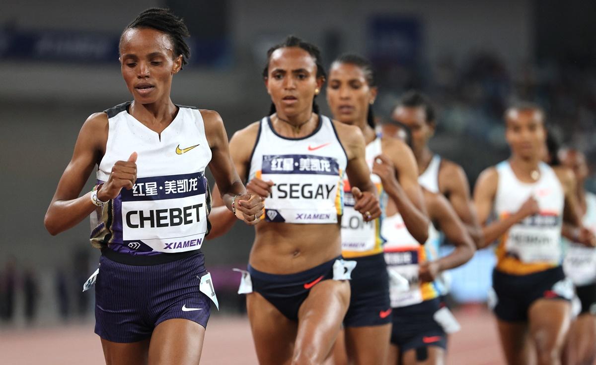 Kenya's Beatrice Chebet pulls away from the field down the home straight to win the 5,000 metres in 14 minutes and 27.12 seconds.