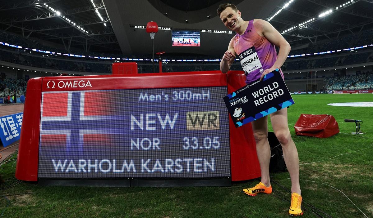 Norway's Karsten Warholm celebrates after setting a new World record in the men's 300 metres.
