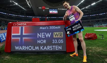 Norway's Karsten Warholm celebrates after setting a new World record in the men's 300 metres.