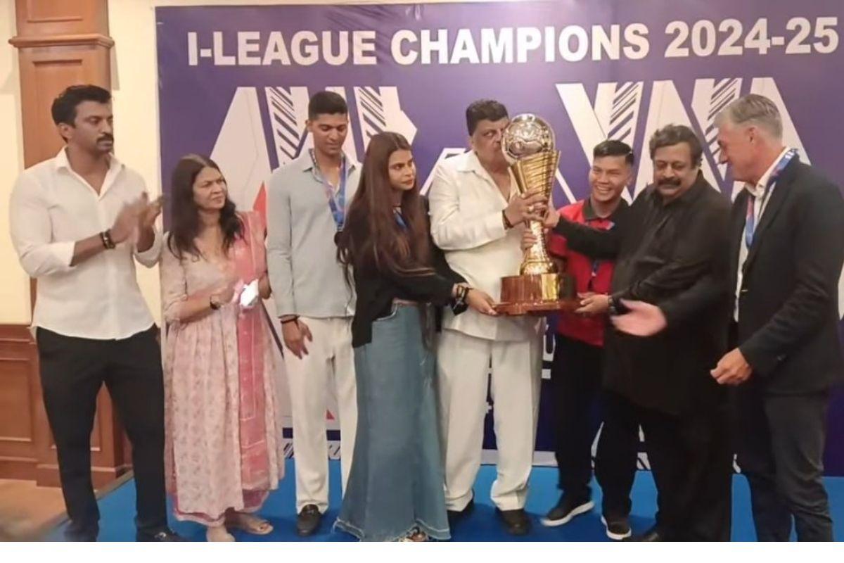 AIFF deputy Secretary General M Satyanarayan presents the I-League trophy to Churchill Brothers owner, Churchill Alemao and the team management and the head coach Dimitris Dimitriou