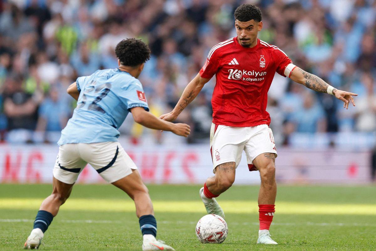 Nottingham Forest's Morgan Gibbs-White in action with Manchester City's Rico Lewis 