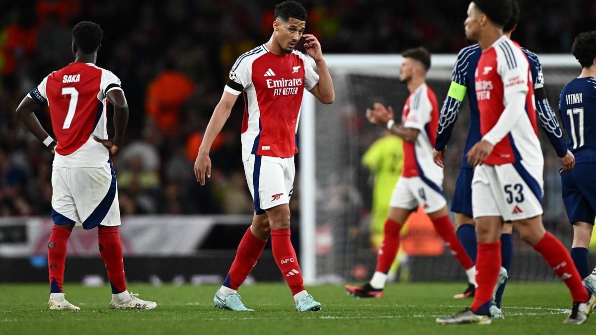 Arsenal players walk off the ground after the Champions League semi-final first leg against Paris Saint Germain at Emirates Stadium, London, on Tuesday.