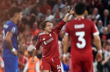 Federico Chiesa celebrates scoring Liverpool's third goal