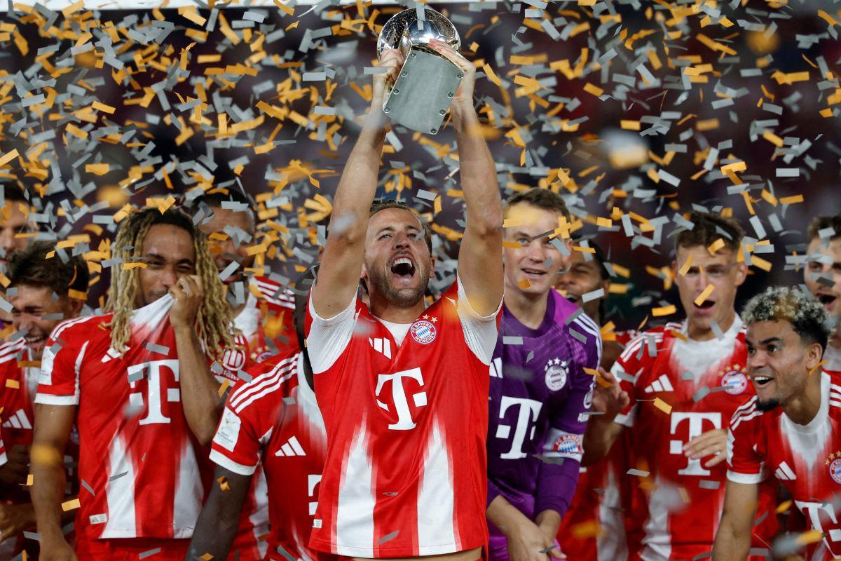 Bayern Munich's Harry Kane celebrates with the trophy after defeating VFB Stuttgart to win the Franz Beckenbauer Supercup 2025 at the MHPArena, Stuttgart, Germany, on Saturday