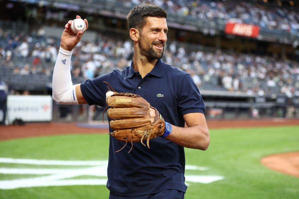 Tennis star Novak Djokovic prepares to throw out the first pitch prior to the game between the Boston Red Sox and the New York Yankees at Yankee Stadium at Bronx, New York, USA, on Thursday