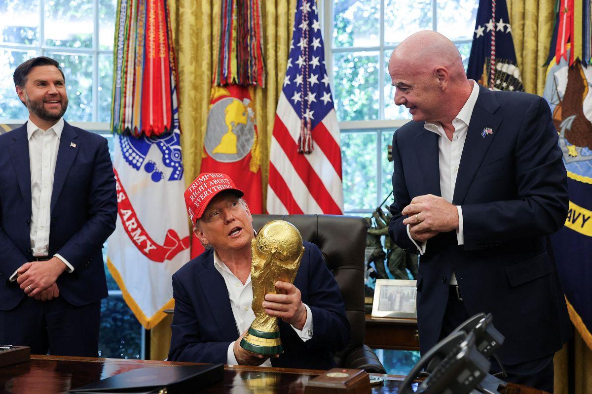FIFA President Gianni Infantino presents the first ticket of the 2026 FIFA World Cup to US President Donald Trump on Friday