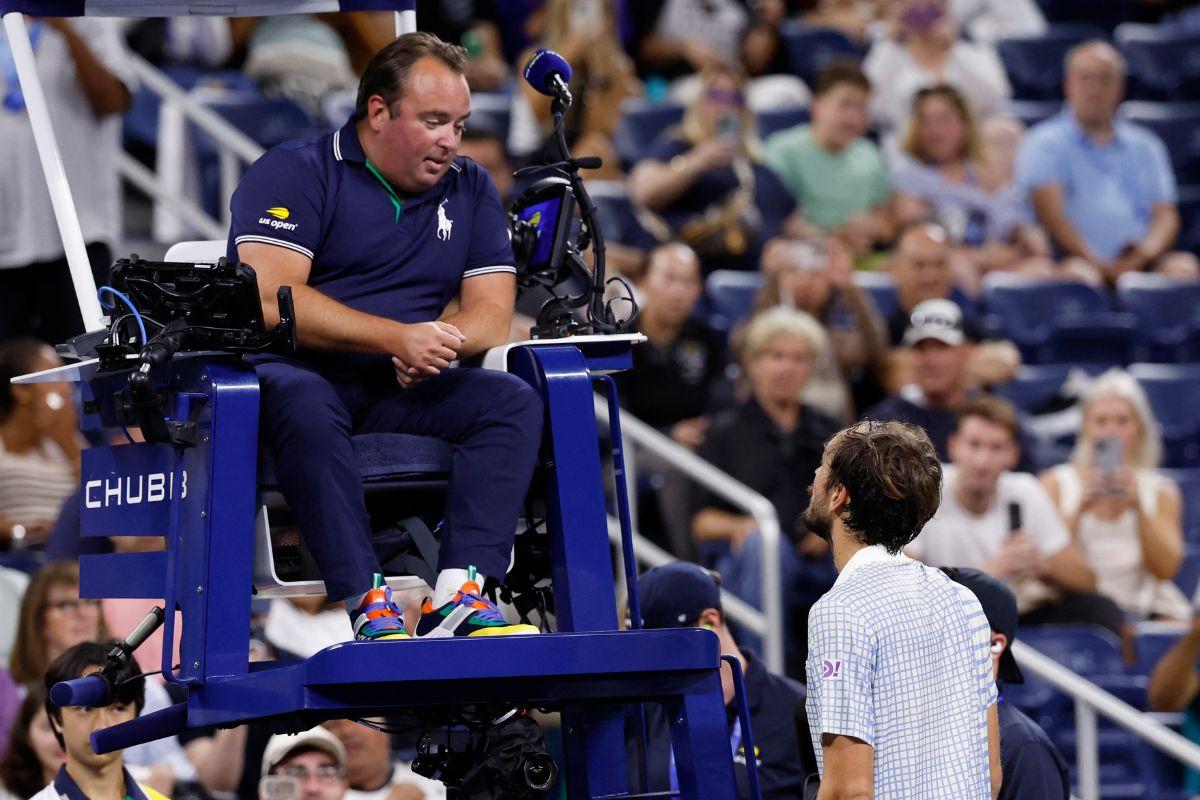 Russia's Daniil Medvedev talks to the chair umpire during his first round match against France's Benjamin Bonzi