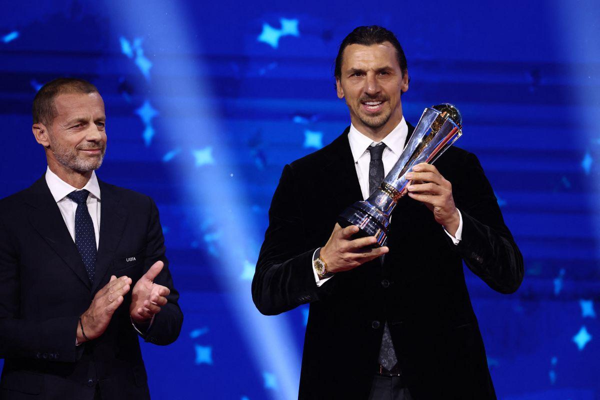 Former footballer Zlatan Ibrahimovic receives the UEFA President's Cup ahead of the UEFA Champions League draw on Thursday