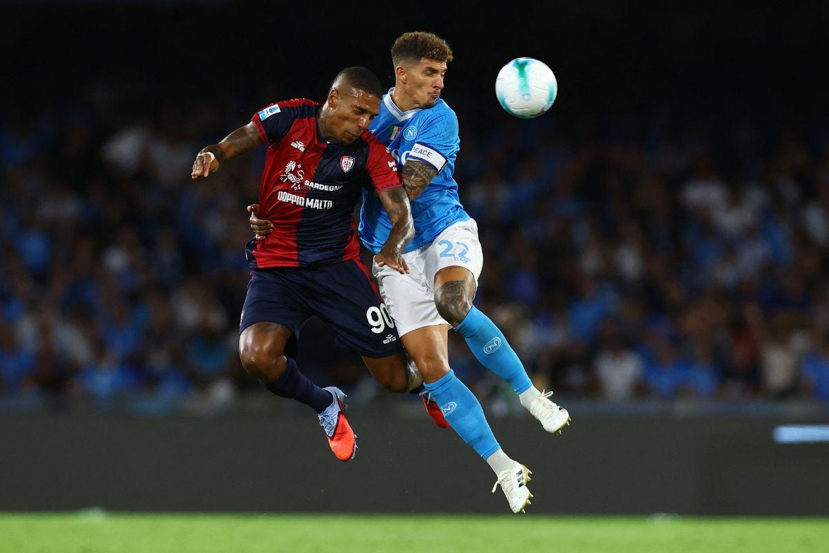 Napoli's Giovanni Di Lorenzo in action with Cagliari's Michael Folorunsho in their Serie A match at Stadio Diego Armando Maradona, Naples