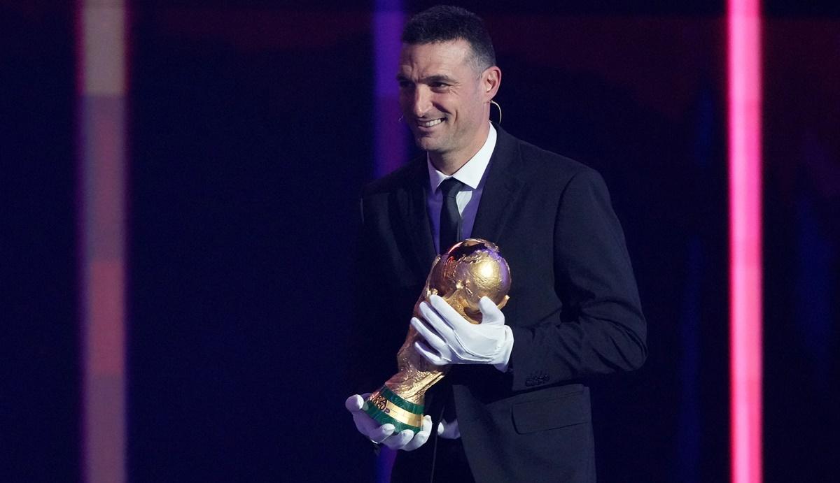 Argentina coach Lionel Scaloni brings the World Cup trophy to the stage during the FIFA World Cup 2026 draw at John F. Kennedy Center for the Performing Arts, Washington, D.C., on Friday.