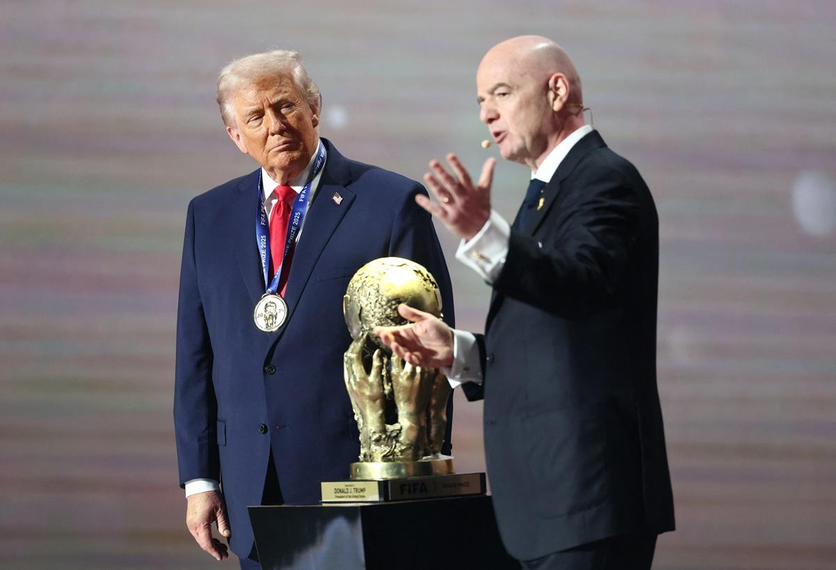 US President Donald Trump on stage with FIFA President Gianni Infantino as he is awarded the FIFA Peace Prize during the World Cup 2026 draw at John F. Kennedy Center for the Performing Arts, Washington, D.C., on Friday.