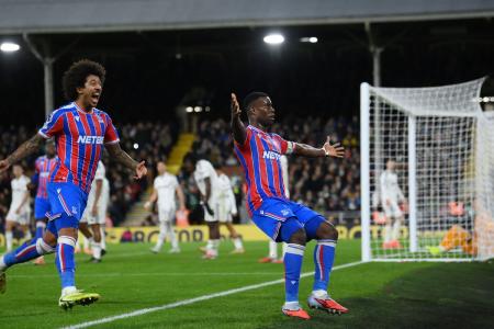Crystal Palace's Marc Guehi celebrates with Chris Richards on scoring their second goal agains Fulham during their match at Craven Cottage, London, Britain