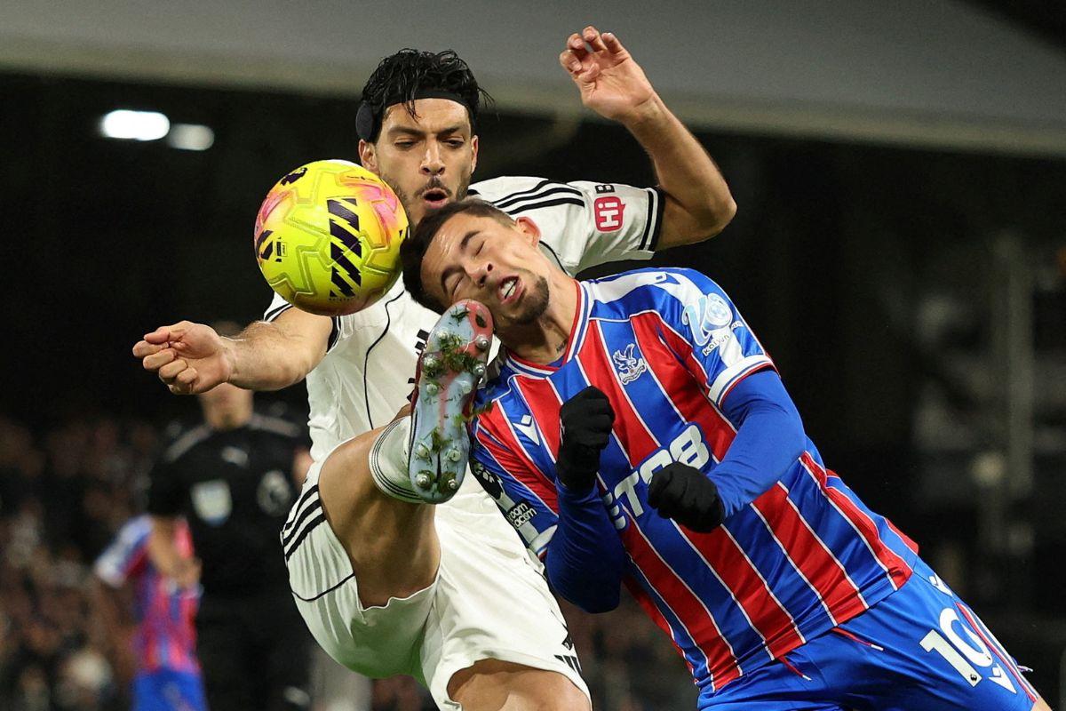 Fulham's Raul Jimenez in action with Crystal Palace's Yeremy Pino