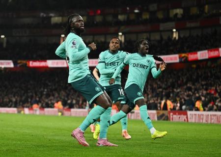 Tolu Arokodare celebrates with Jhon Arias and Mateus Mane after drawing Wolverhampton Wanderers level in the 90th minute of the match.