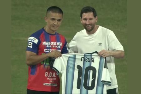 Indian football legend Sunil Chhetri is gifted a jersey by Argentina great Lionel Messi during the Mumbai leg of the latter's GOAT tour on Sunday