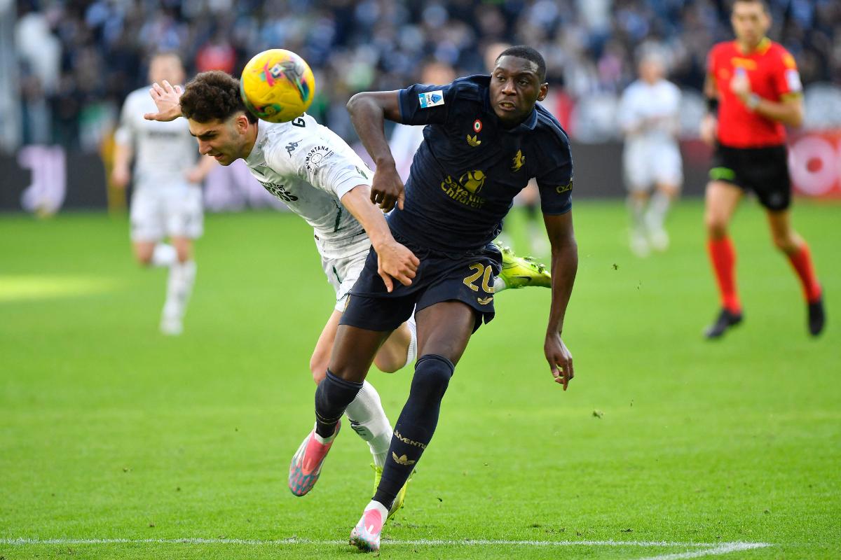 Juventus' Randal Kolo Muani in action with Empoli's Saba Goglichidze