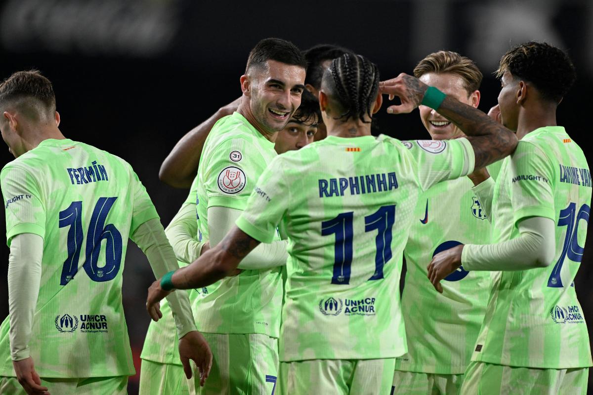 FC Barcelona's Ferran Torres celebrates with Raphinha after scoring their fourth goal to complete his hat-trick in the Copa del Rey Quarter Final against Valencia at Estadio de Mestalla, Valencia, Spain, on Thuesday 