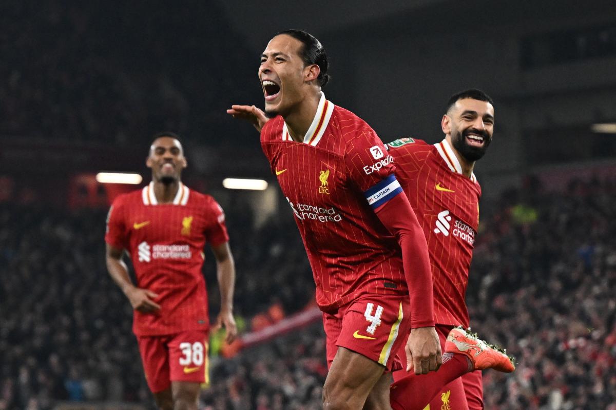 Liverpool's Virgil van Dijk celebrates scoring their fourth goal with Mohamed Salah during the League Cup semi-final second leg at Anfield, Liverpool on Thursday