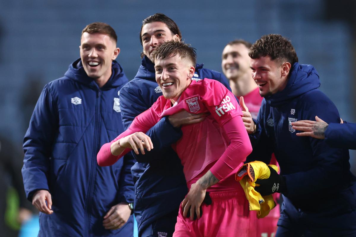 Ipswich players celebrate with Jack Clarke, who scored a brace.