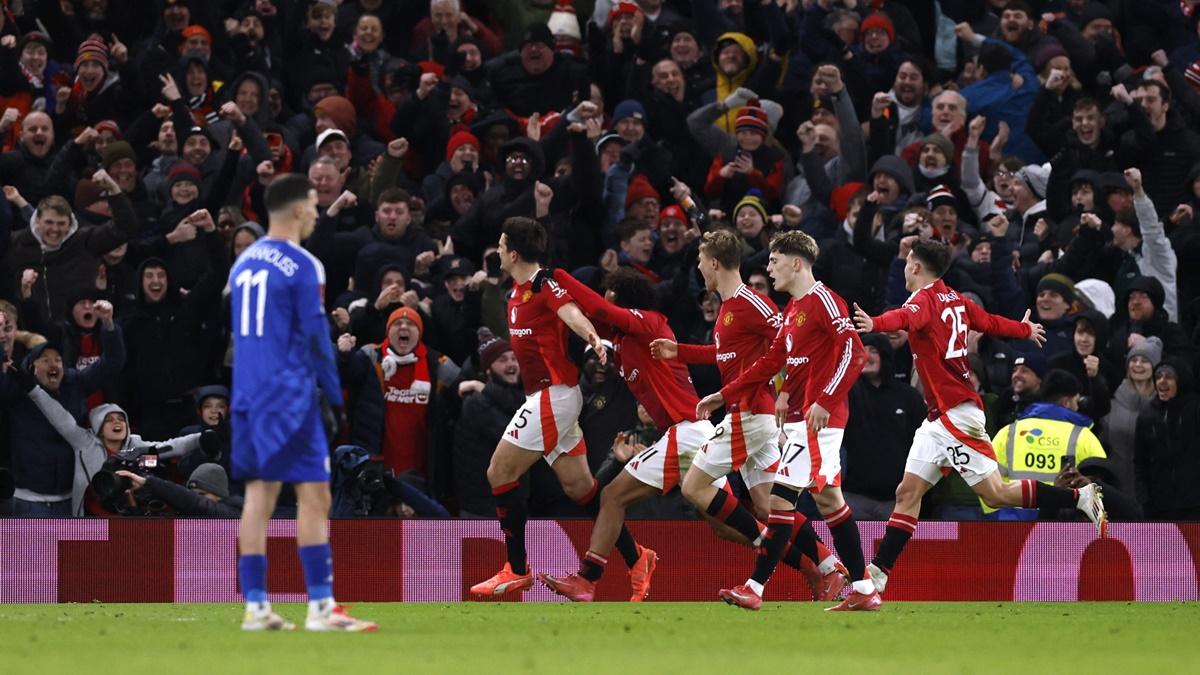 Harry Maguire breaks into celebration with teammates after scoring Manchester United's second goal during the FA Cup fourth round against Leicester City at Old Trafford, Manchester, on Friday.