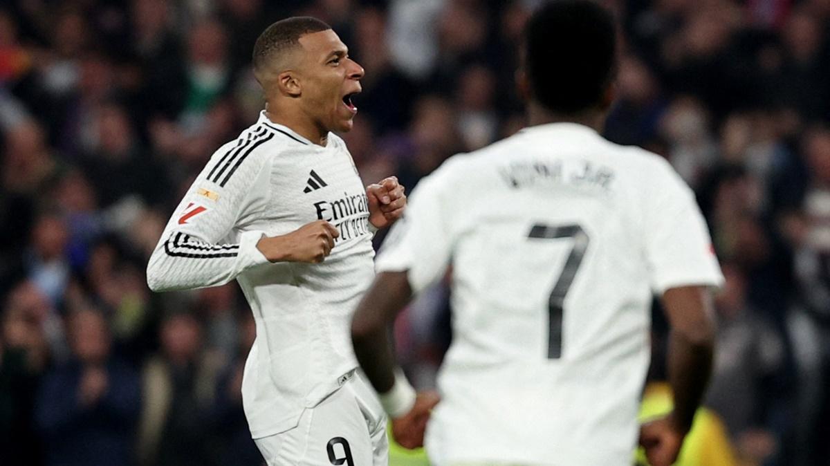 Kylian Mbappe celebrates with Vinicius Junior after scoring the equaliser for Real Madrid in the LaLiga match at Santiago Bernabeu, Madrid, on Saturday.