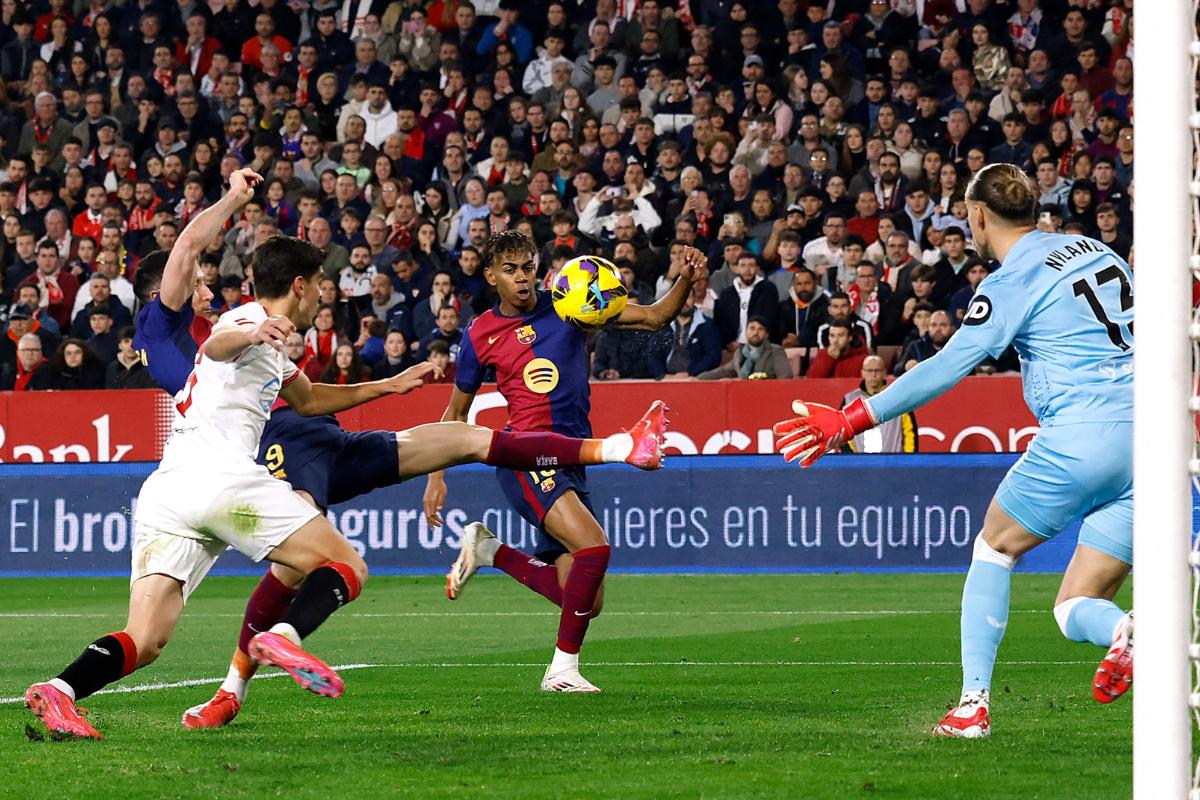 FC Barcelona's Robert Lewandowski scores their first goal against Sevilla at Ramon Sanchez Pizjuan, Seville