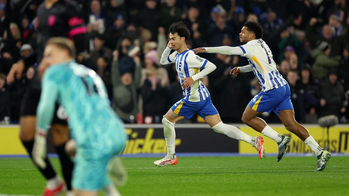 Kaoru Mitoma celebrates scoring Brighton & Hove Albion's first goal with Georginio Rutter in the Premier League match against Chelsea at the American Express Community Stadium, Brighton, on Friday.