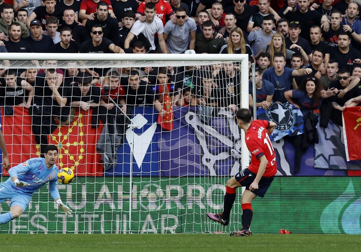 Ante Budimir scores from the penalty spot past Real Madrid goalkeeper Thibaut Courtois to draw Osasuna level.